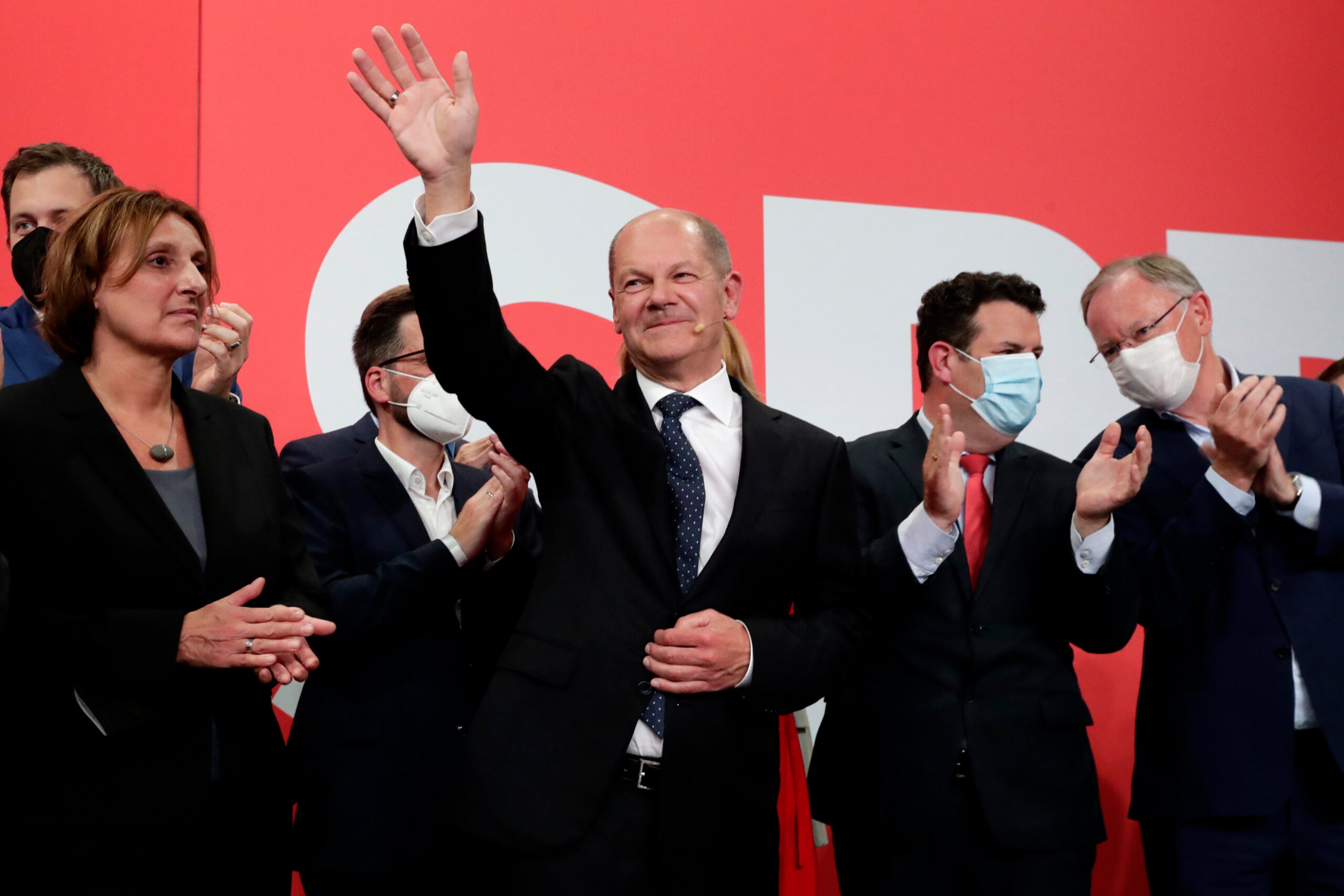SPD's Olaf Scholz waves to his supporters after German parliament election at the party's headquarters in Berlin