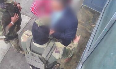 Surveillance video shows a man being detained by masked U.S. Immigration and Customs Enforcement (ICE) officers in San Francisco's South of Market neighborhood on Monday.