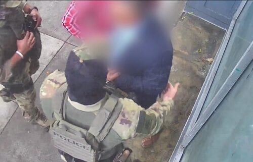 Surveillance video shows a man being detained by masked U.S. Immigration and Customs Enforcement (ICE) officers in San Francisco's South of Market neighborhood on Monday.