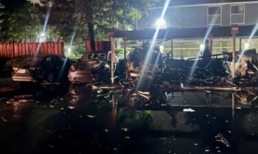 Nearly two dozen vehicles were damaged and a carport was destroyed following a fire at a San Jose housing complex early Friday morning.